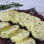 tarragon compound butter on a serving tray