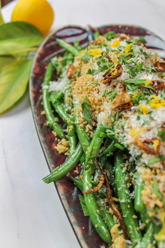 green beans with garlic bread crumbs, lemon zest, parmesan, and fried shallots