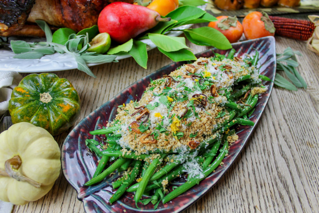 thanksgiving table with green beans with garlic bread crumbs