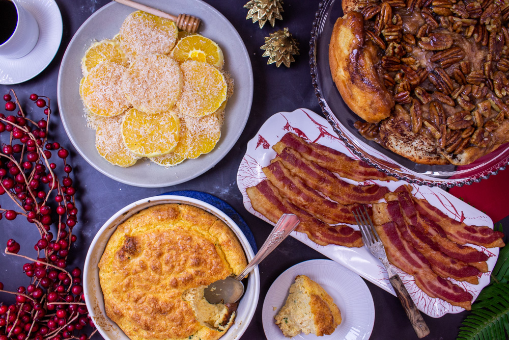 Christmas breakfast: egg souffle with oranges, sticky pecan rolls, and bacon 