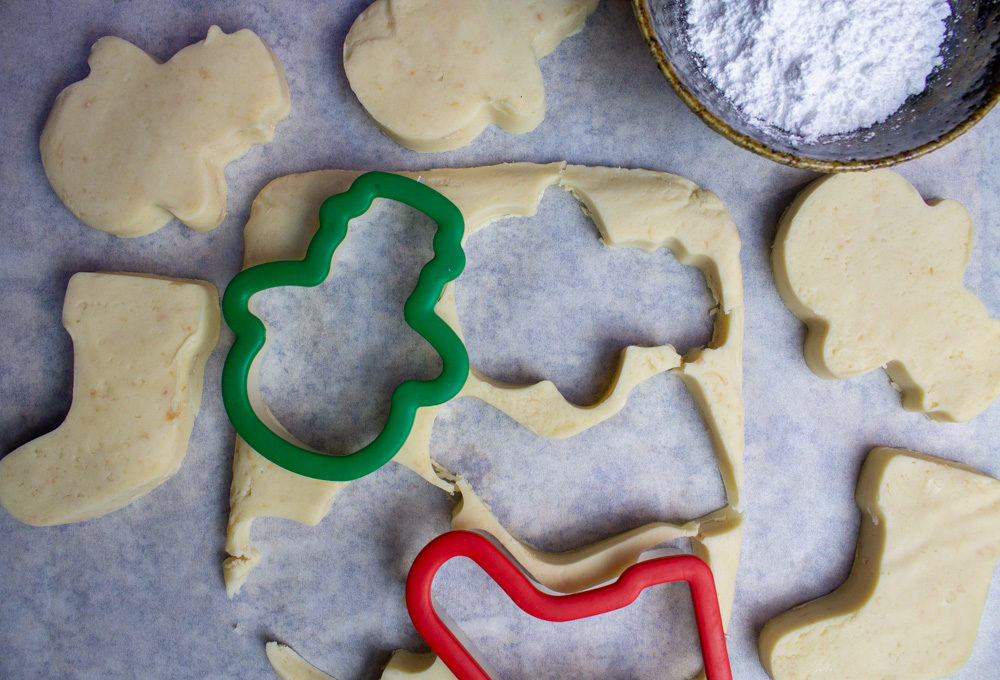 shortbread dough with christmas cookie cutters