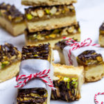 shortbread nut bars with chocolate drizzle wrapped in parchment with red baker's twine