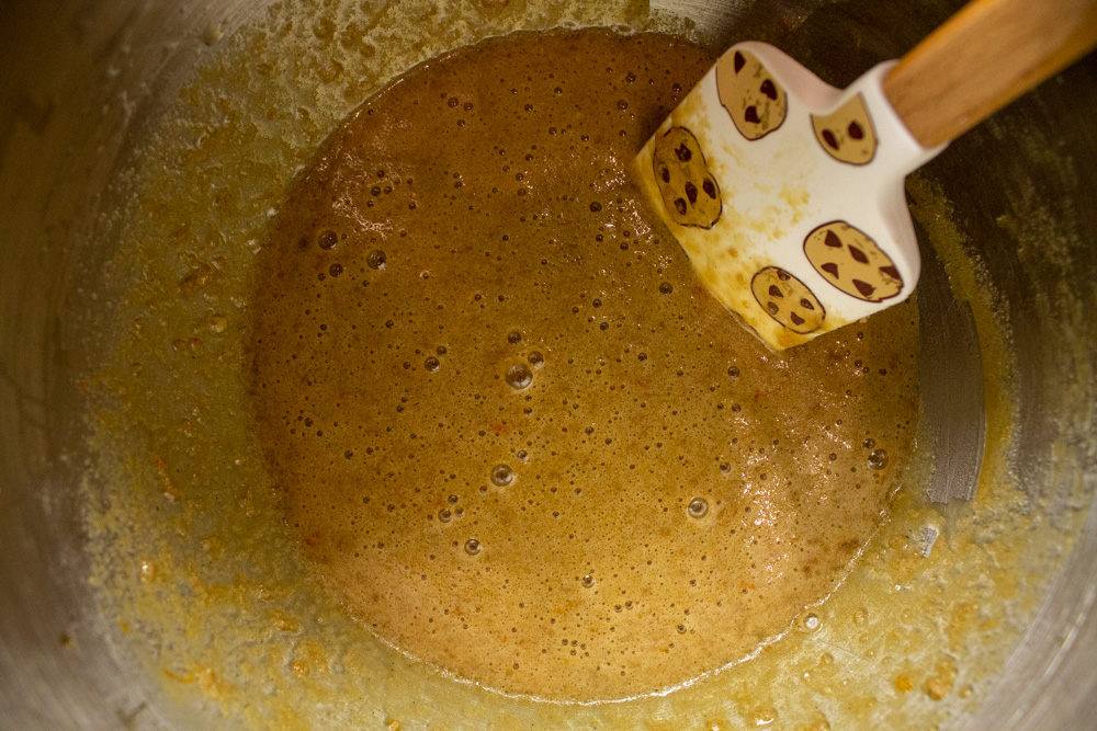 caramel filling in steel bowl with spatula