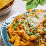 spicy rigatoni with sausage, basil , and Parmesan