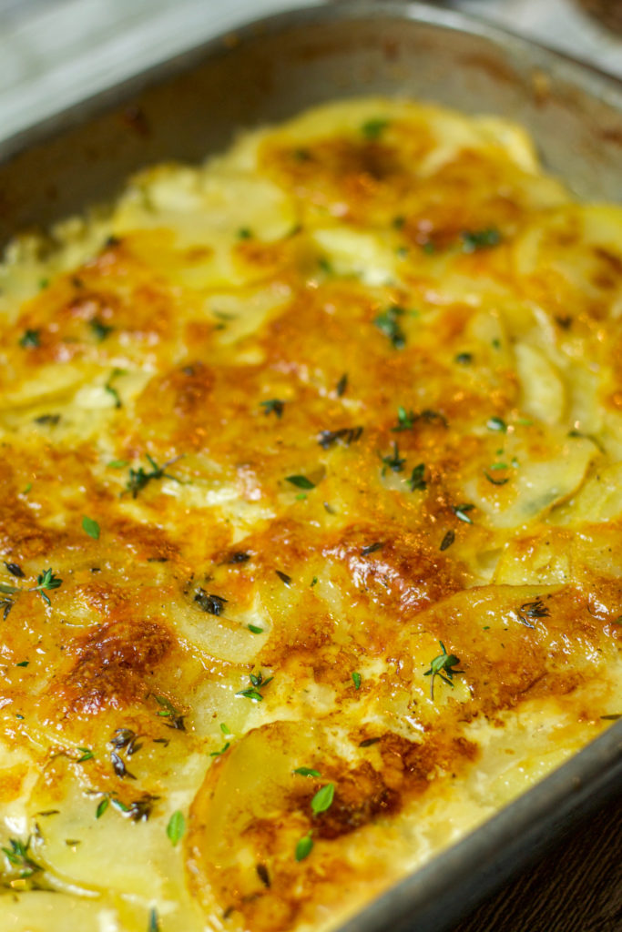 scalloped potatoes topped with thyme