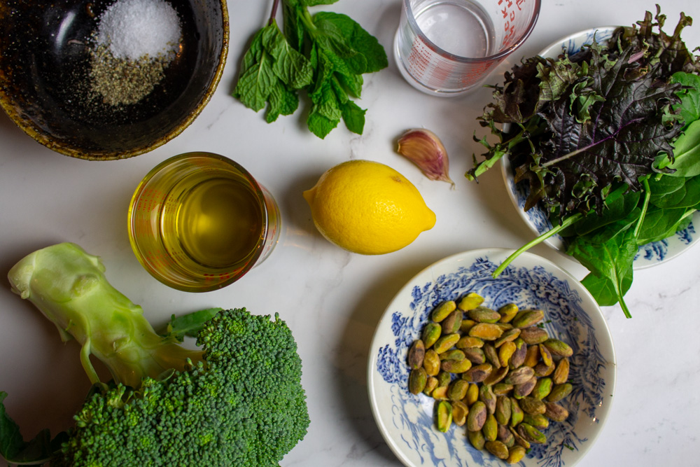 broccoli, salt, pepper, olive oil, mint, lemon, pistachios, garlic, water, kale, and spinach