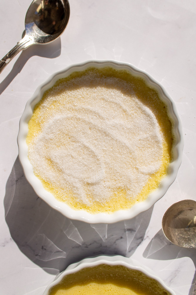 crème brûlée with sugar before caramelizing