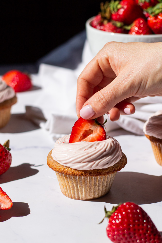 strawberry cupcakes with strawberry cream cheese icing and strawberry core