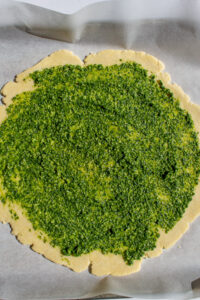 pesto on pie crust