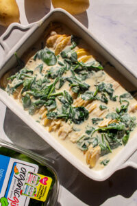 potatoes au gratin with spinach before baking