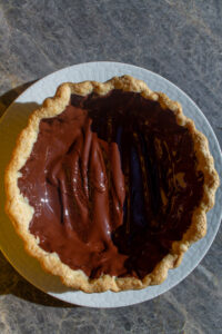 pie crust lined with chocolate