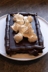 Layering the Fudgy Chocolate Peanut Butter Cake